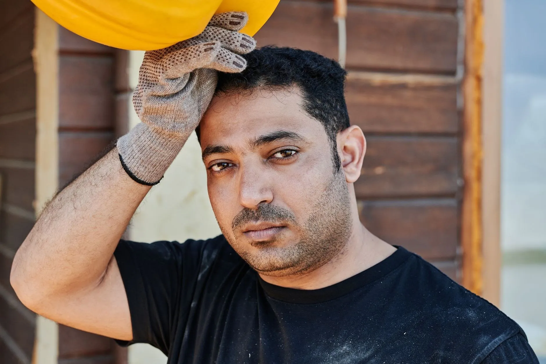 Des Plaines crew member performing brick mortar repair on a Chicago suburb home